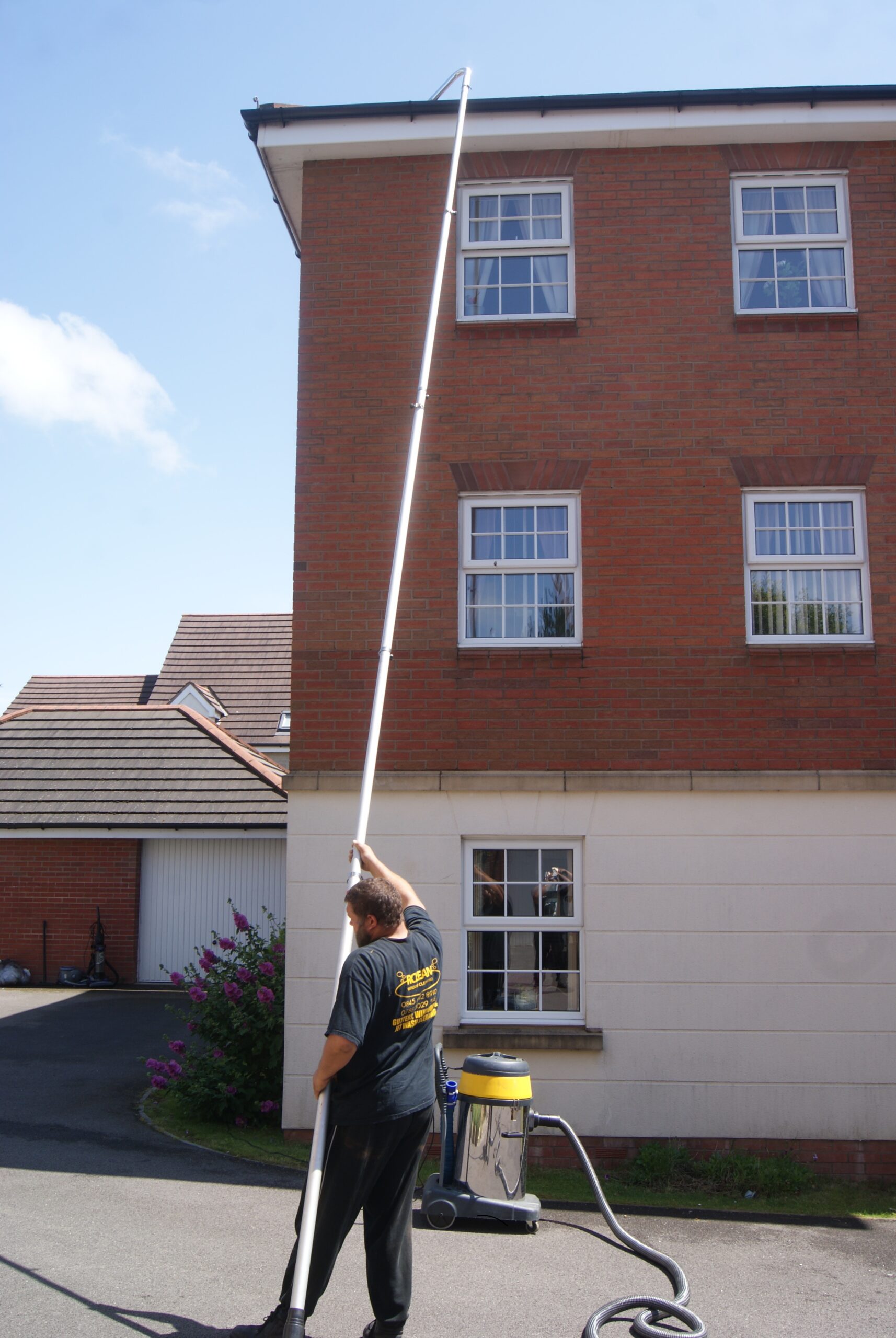 //tuckerpros.com/wp-content/uploads/2024/06/pressure_washing_and_high_reach_window_cleaning_1651-scaled.jpg